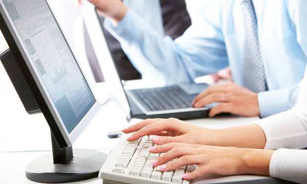 Woman typing on keyboard